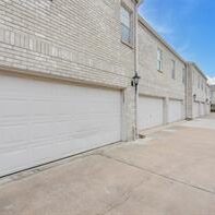 A row of garage doors on the side of a building.